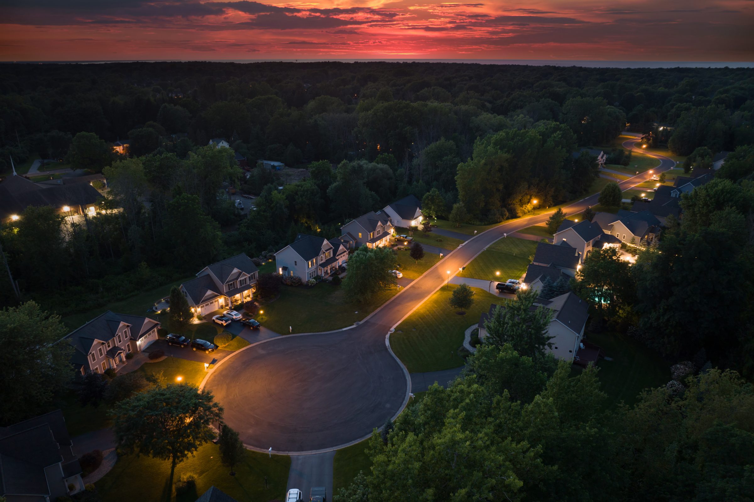 Aerial view of a residential neighborhood at dusk